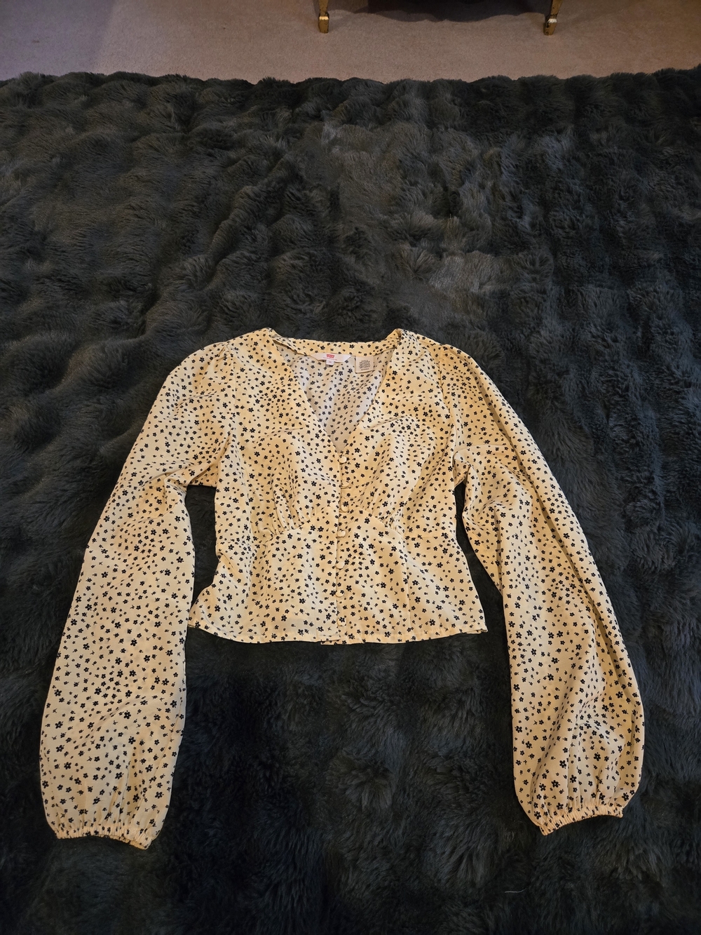 Levi's Cream Long-Sleeve V-Neck Peplum Top with Black Star Print